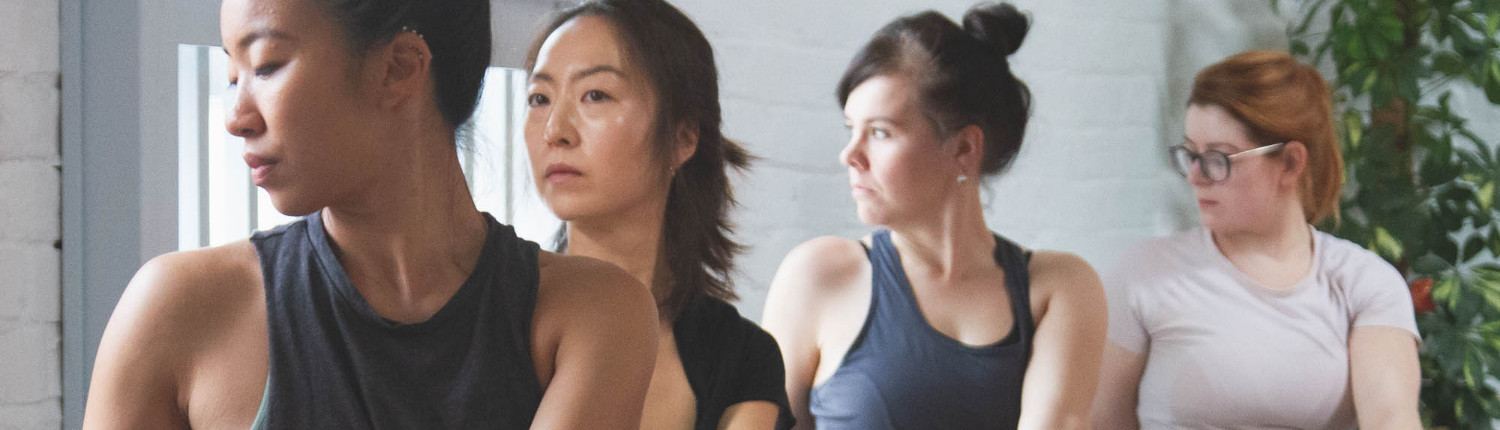 Teacher trainees sitting together in the studio during a training session