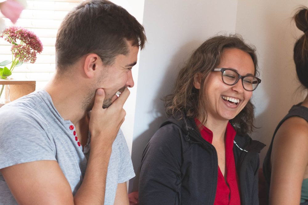 Students chatting and laughing together at the studio
