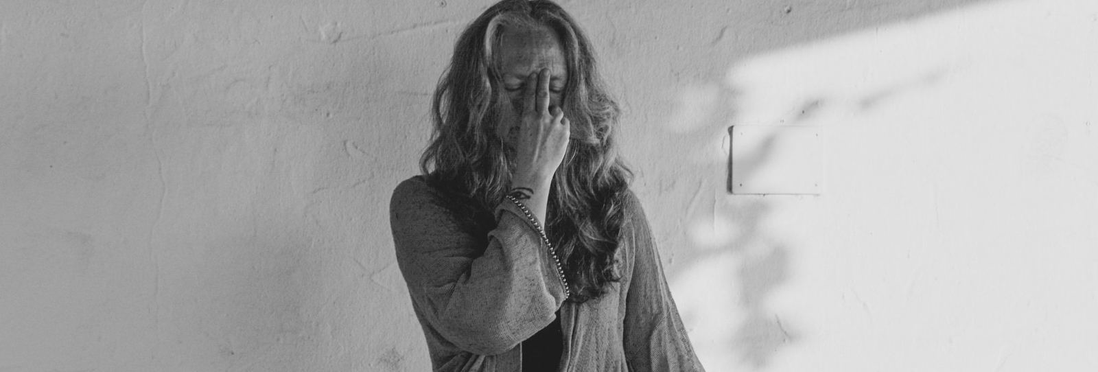 Melanie Cooper practising alternate nostril breathing, in black and white